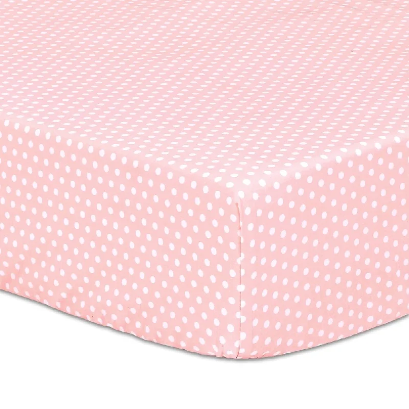 The Peanushell Dot Cotton Fitted Crib Sheet in Light Coral